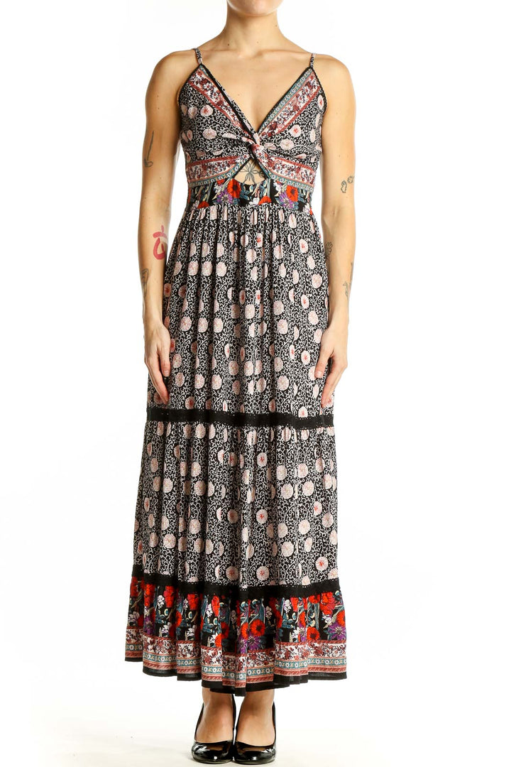 Front view of SilkRoll black floral maxi dress with cutout detail