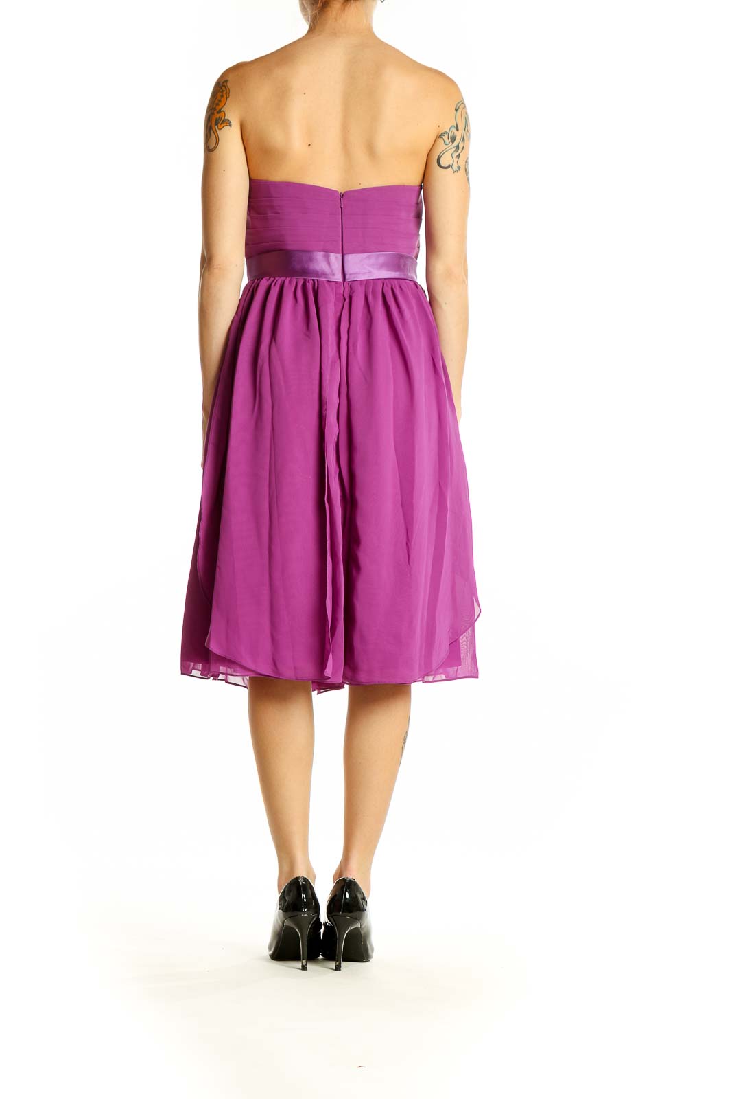 Side view of purple strapless cocktail dress showing flowy chiffon skirt