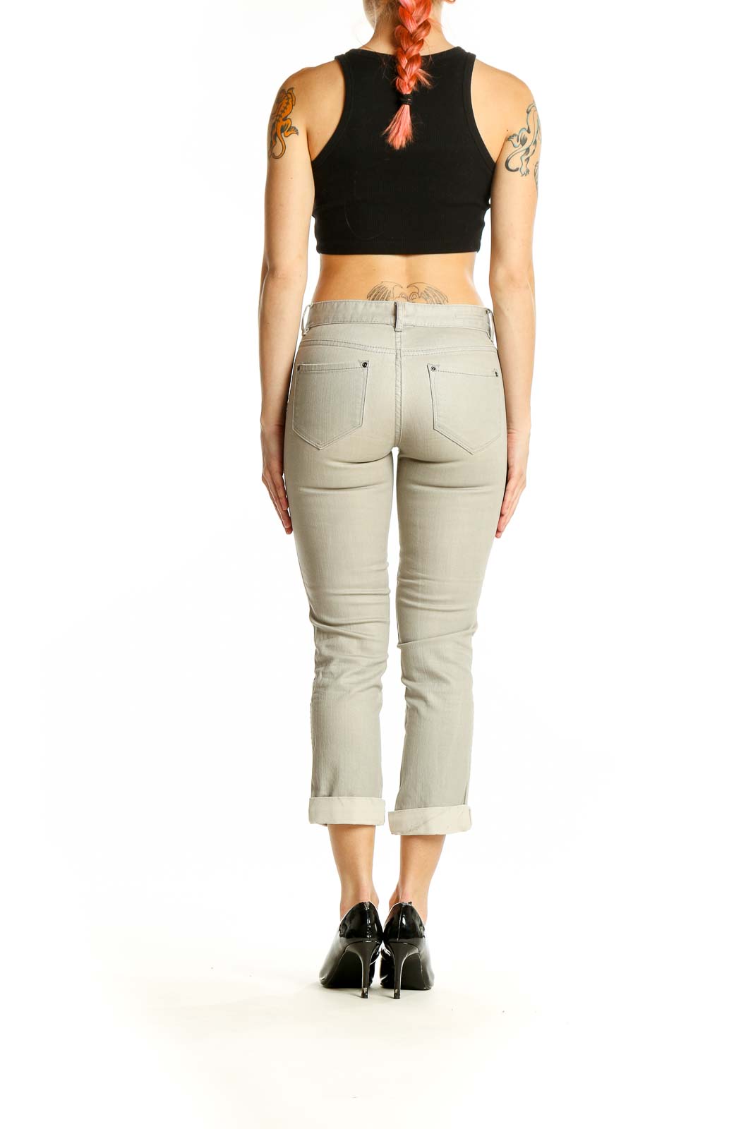 Side view of Club Monaco beige cropped jeans on model with black crop top