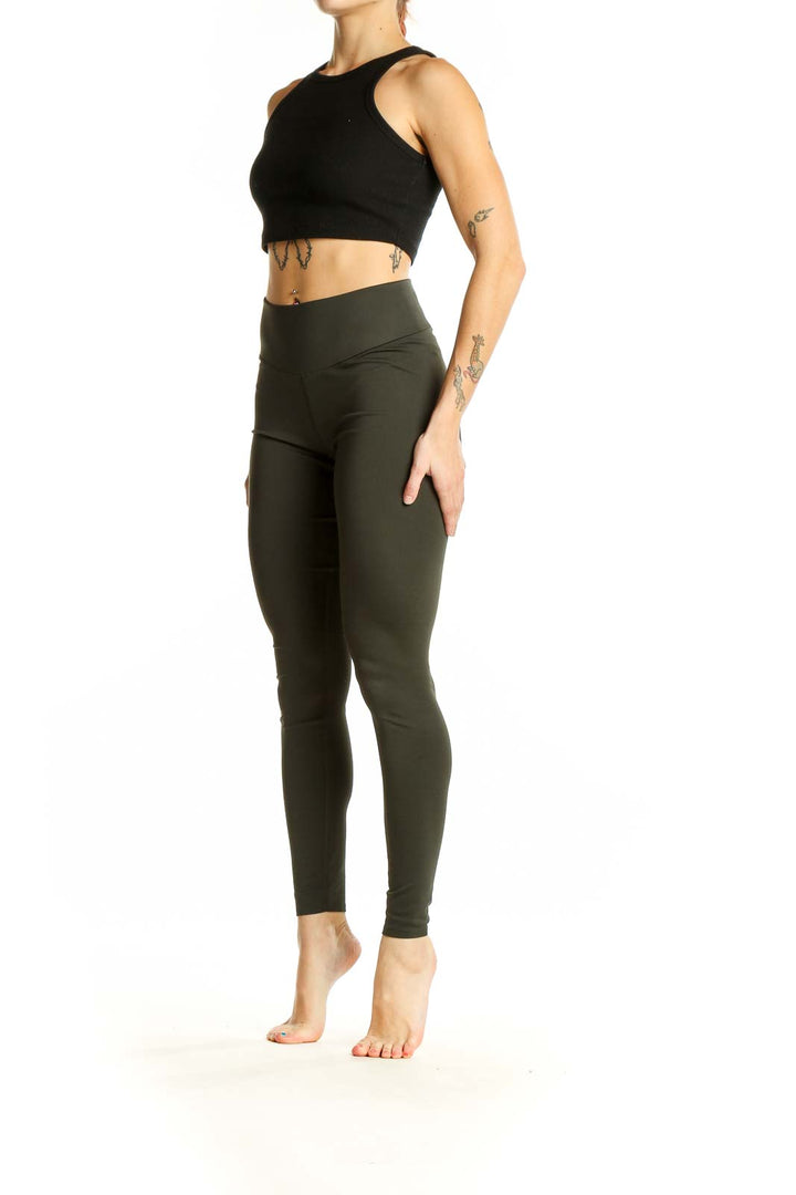 Front view of olive Uniqlo high-waisted performance leggings