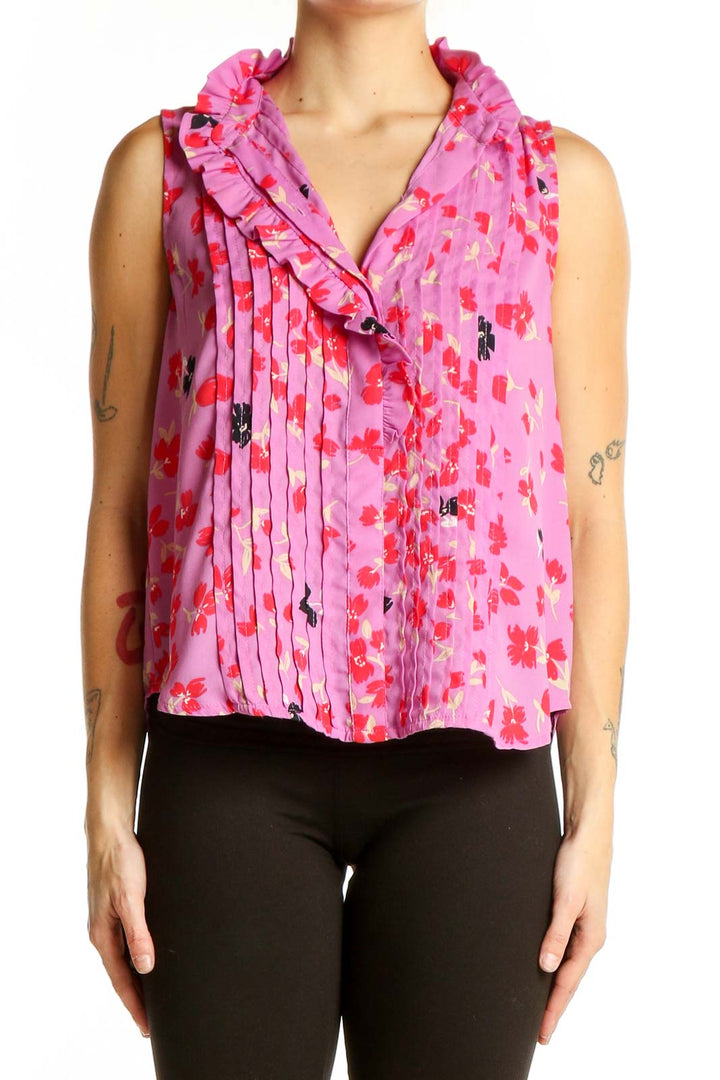 Front view of Ann Taylor pink floral sleeveless blouse with ruffled collar