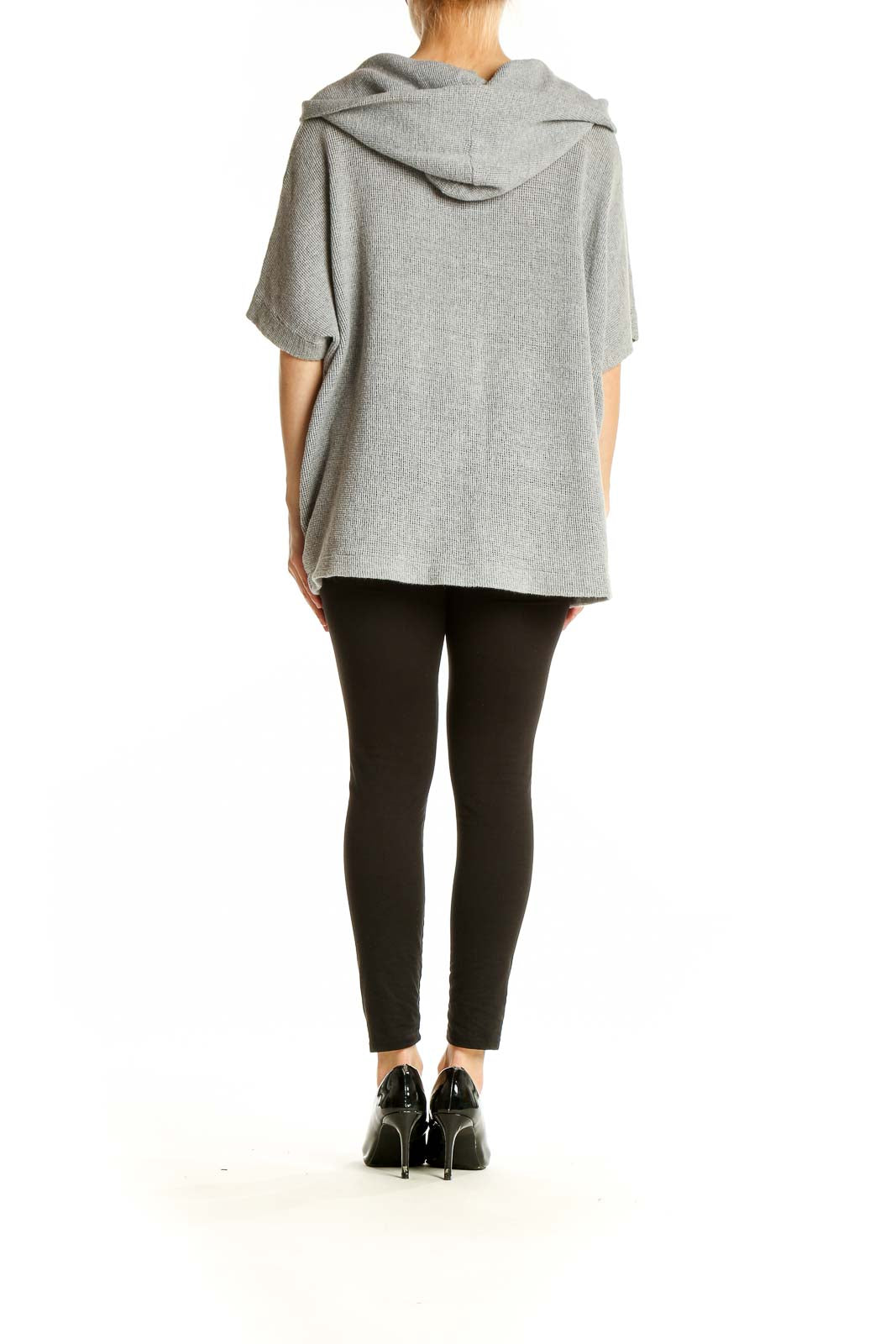 Side view of gray knit poncho top by Standard James Perse on model