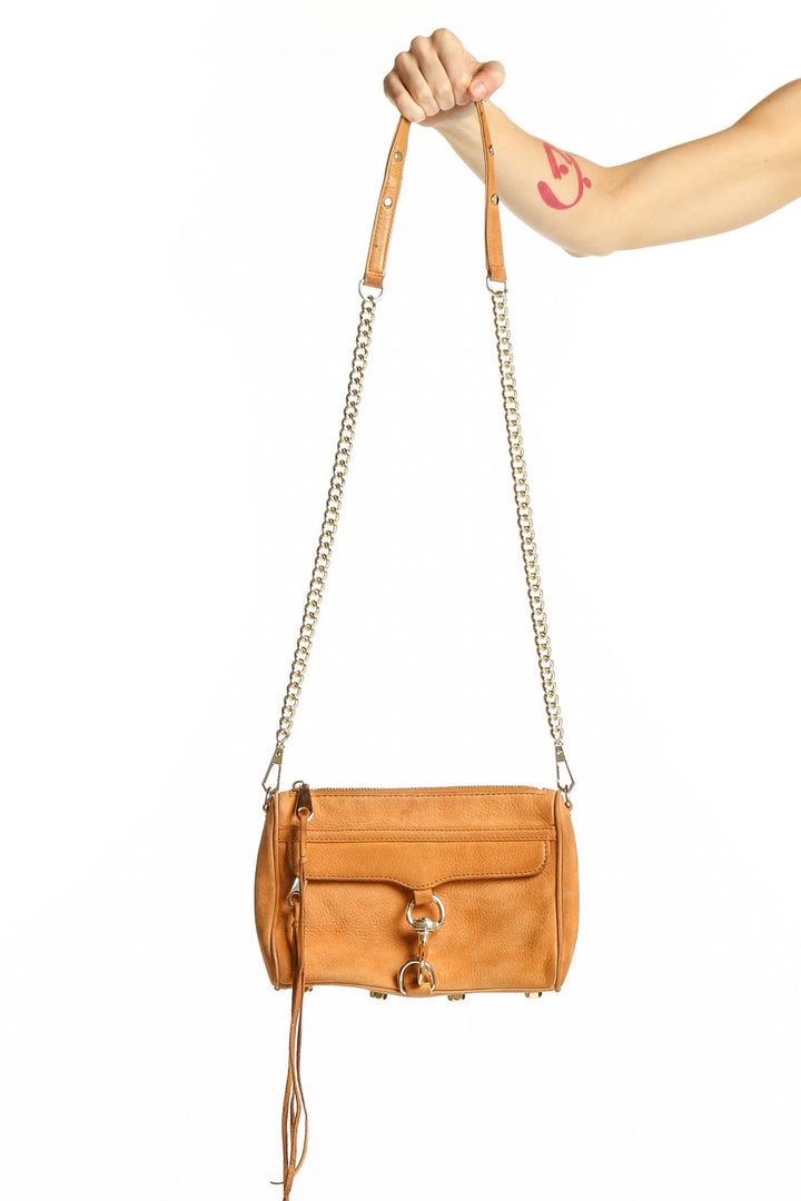 Front view of Rebecca Minkoff tan leather crossbody bag with gold-tone hardware