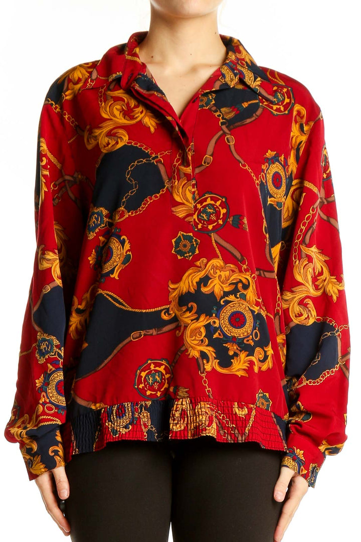 Front view of Alfred Dunner red blouse with ornate chain print and ruffle hem