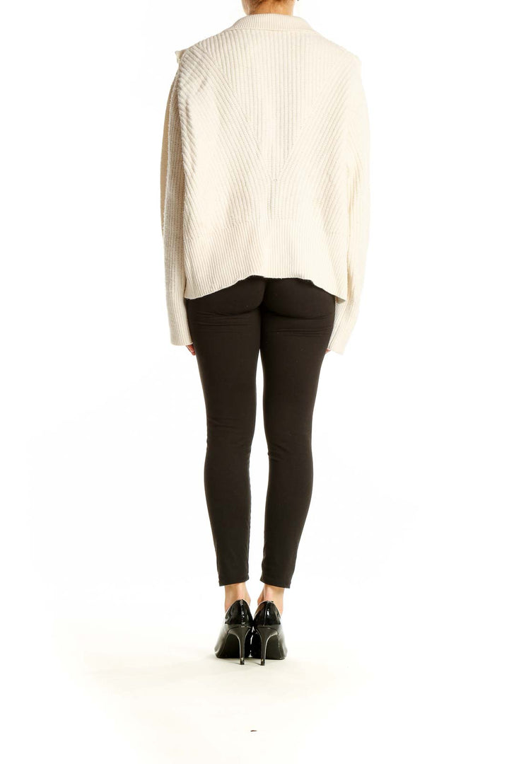 Side view of Derek Lam cream ribbed sweater showing oversized fit