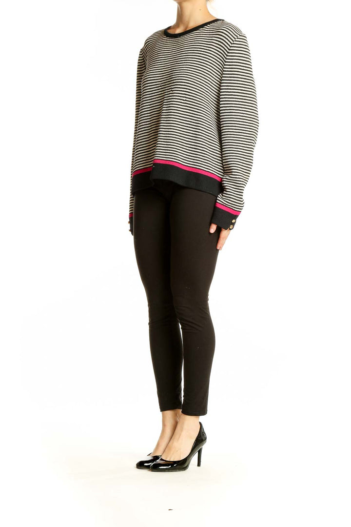 Front view of St. John Sport black and white striped knit sweater with pink trim