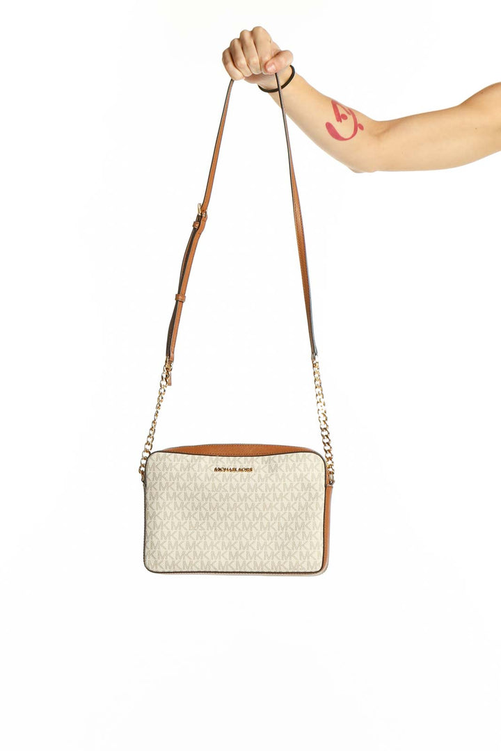 Front view of Michael Kors Vanilla Monogram Crossbody Bag with brown leather trim