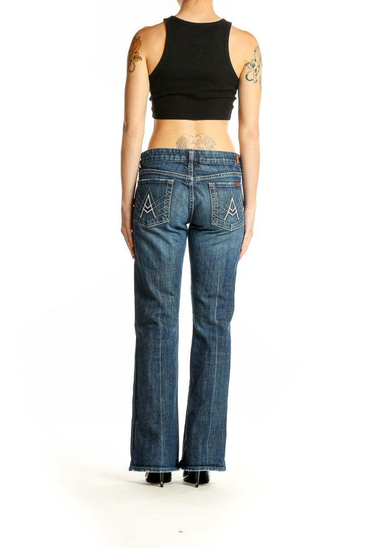 Back view of 7 For All Mankind blue denim bootcut jeans on model