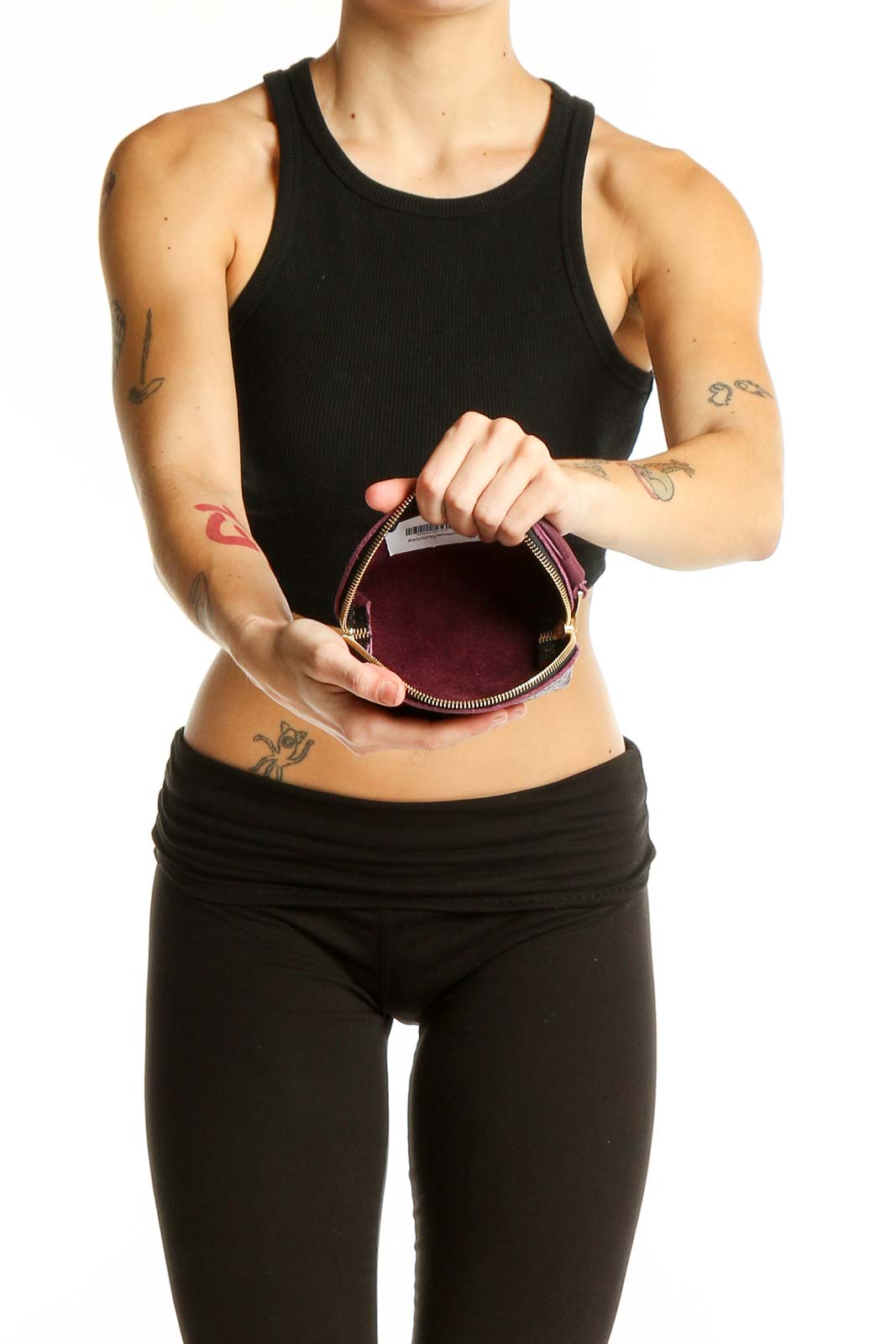 Model holding burgundy leather clutch from A Portland leather goods