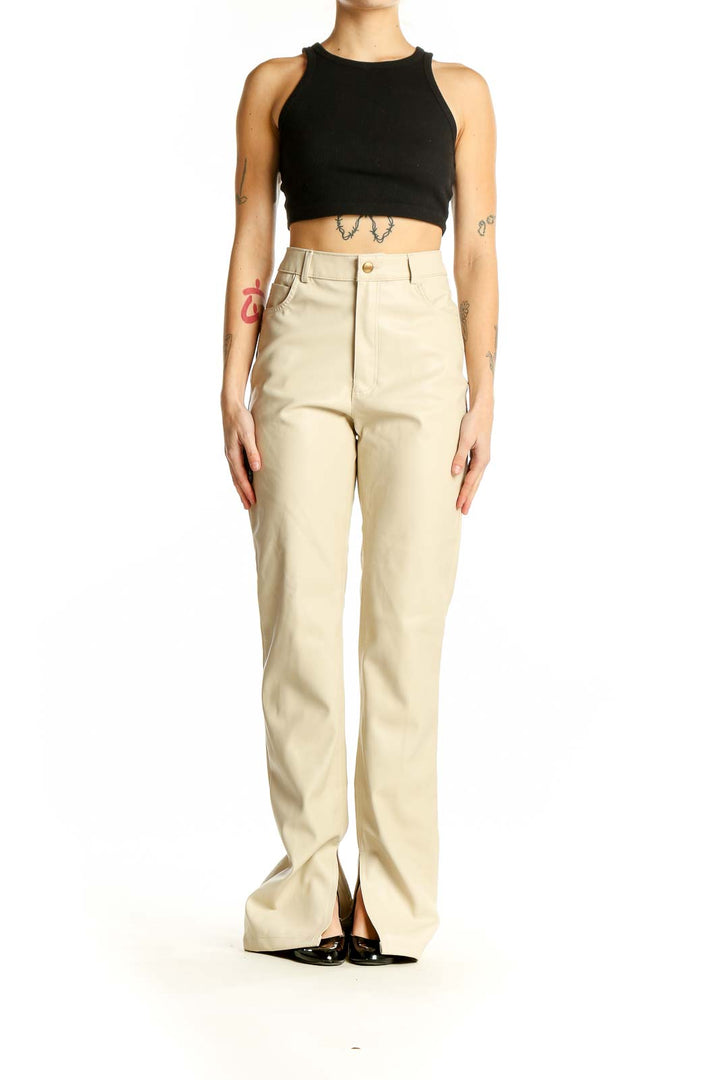 Front view of Zara beige high-waisted trousers with split hems