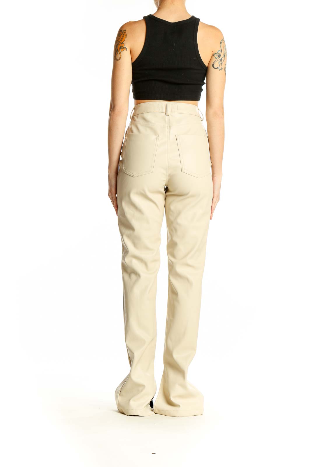 Side view of model wearing Zara beige high-waisted trousers with black top