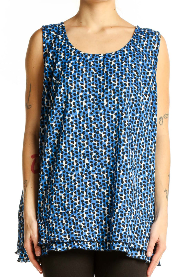 Front view of Ann Taylor blue patterned sleeveless blouse with geometric print