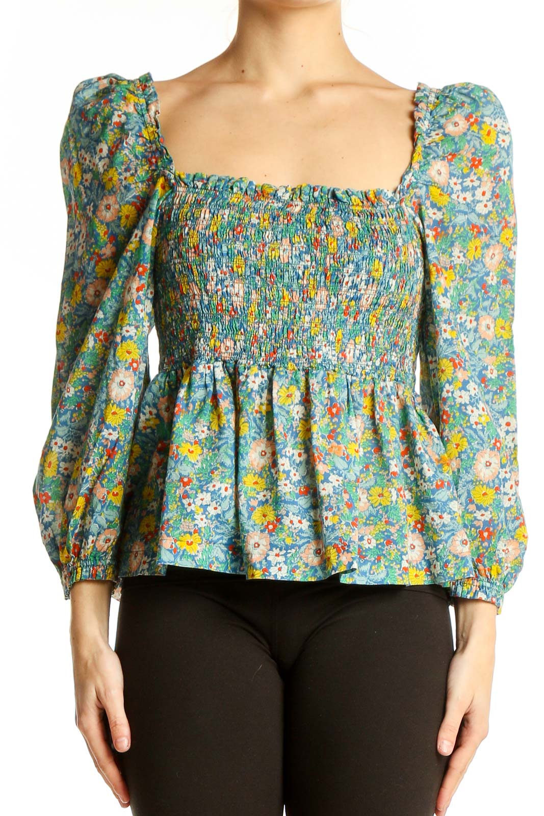 Front view of Bird of Paradis by Trovata floral cotton peplum top with smocked bodice and puffed sleeves