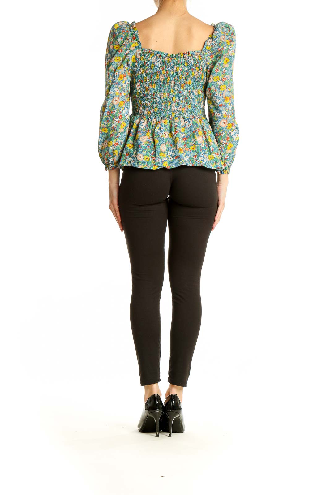 Back view of Bird of Paradis by Trovata floral cotton peplum top showing peplum waist and floral pattern