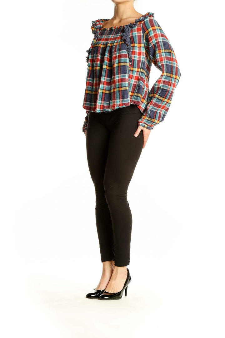 Front view of WE THE FREE multicolor plaid off-shoulder crop top with ruffle details