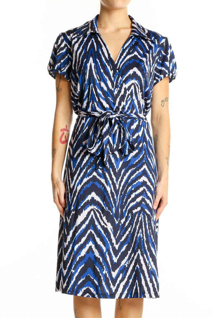 Front view of INC blue zebra print wrap dress with short sleeves