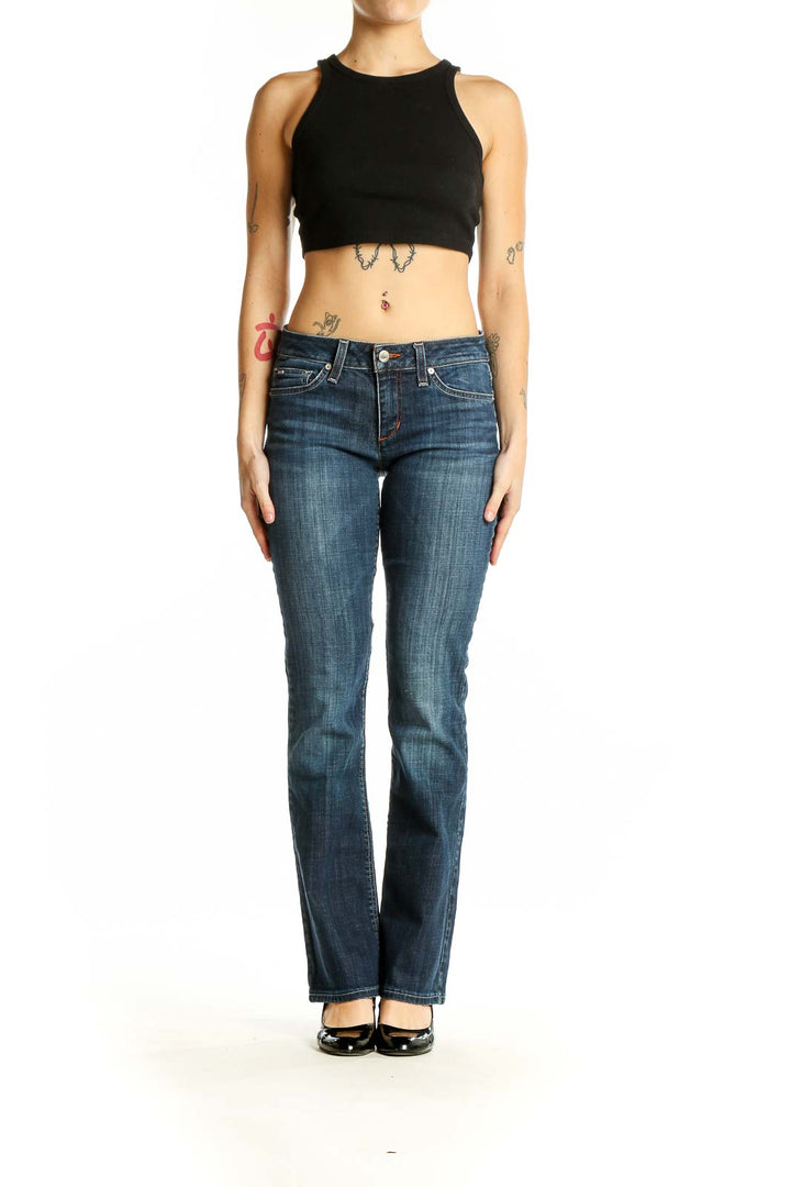 Front view of Joe's blue straight leg jeans on model