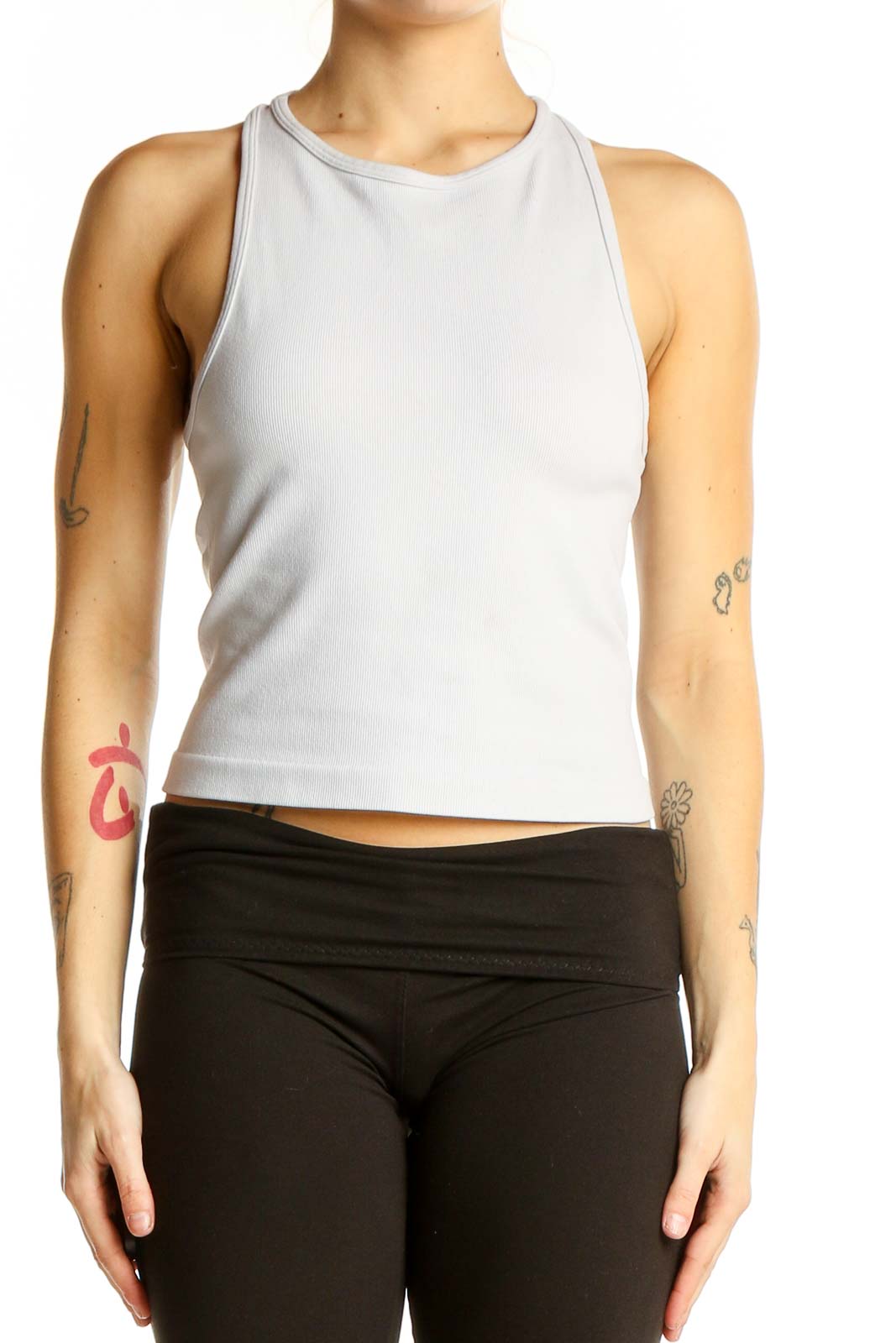 Front view of white SilkRoll racerback crop top on model