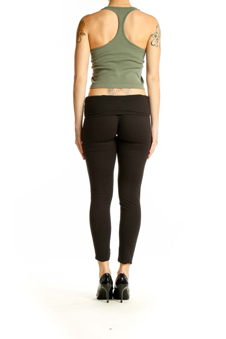 Back view of olive green cropped tank top by SilkRoll showing racerback design