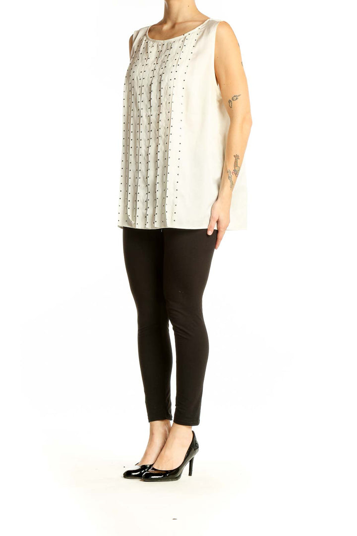 Front view of white Ann Taylor sleeveless blouse with vertical studded detailing