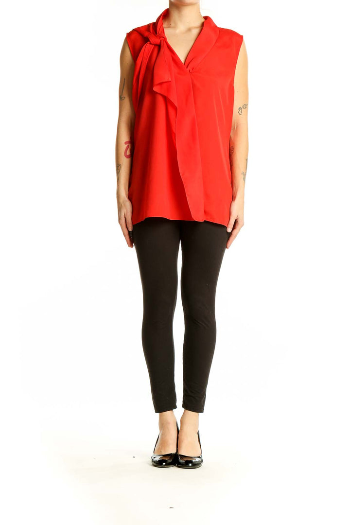 Front view of red Tahari sleeveless blouse with tie-neck detail