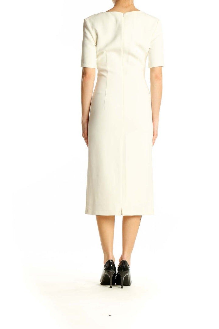 Back view of ADAM LIPPES ivory midi dress showing sleek silhouette