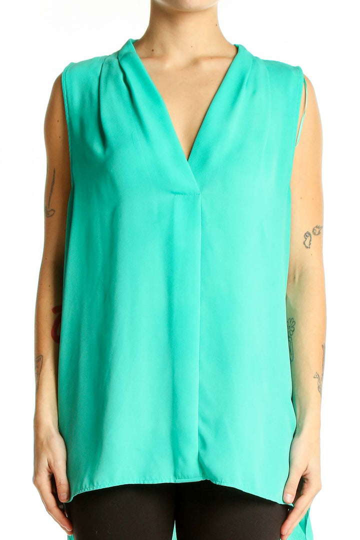 Front view of teal Vince Camuto sleeveless V-neck blouse