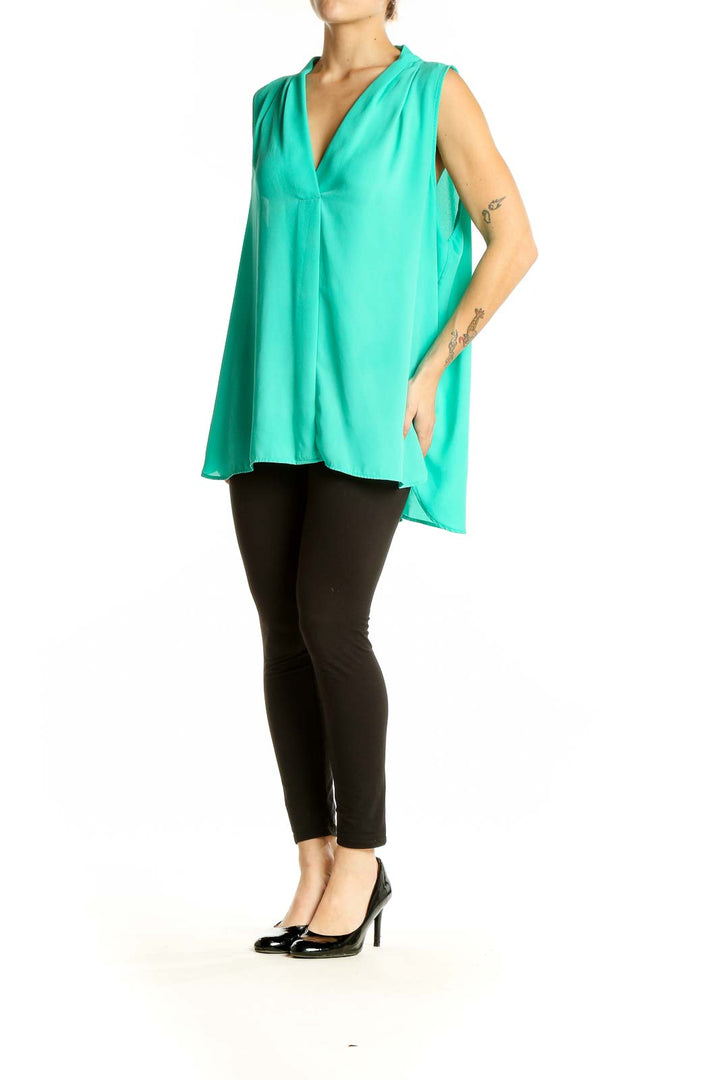 Front view of teal Vince Camuto sleeveless V-neck blouse