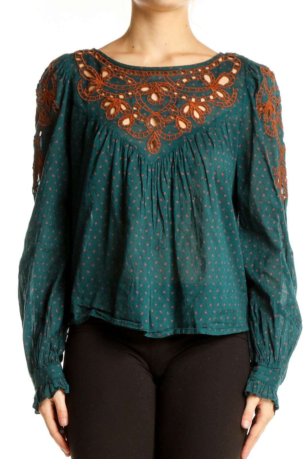 Front view of teal Free People peasant top with rust embroidery