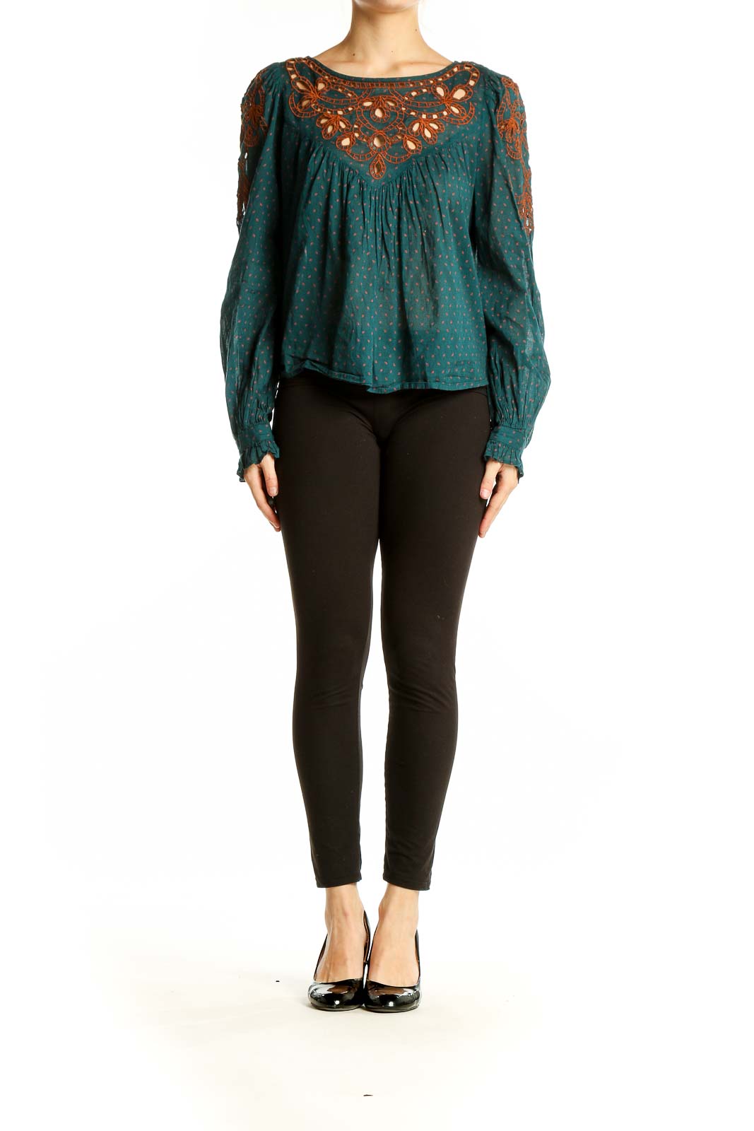 Front view of teal Free People peasant top with rust embroidery