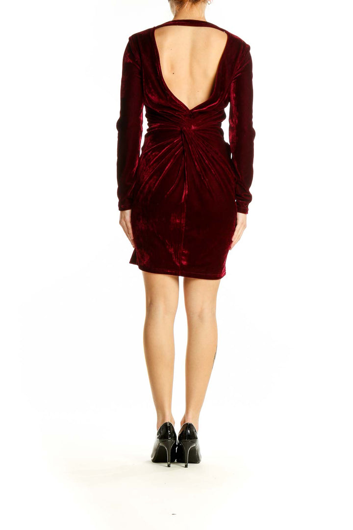 Back view of burgundy velvet long sleeve mini dress by SilkRoll