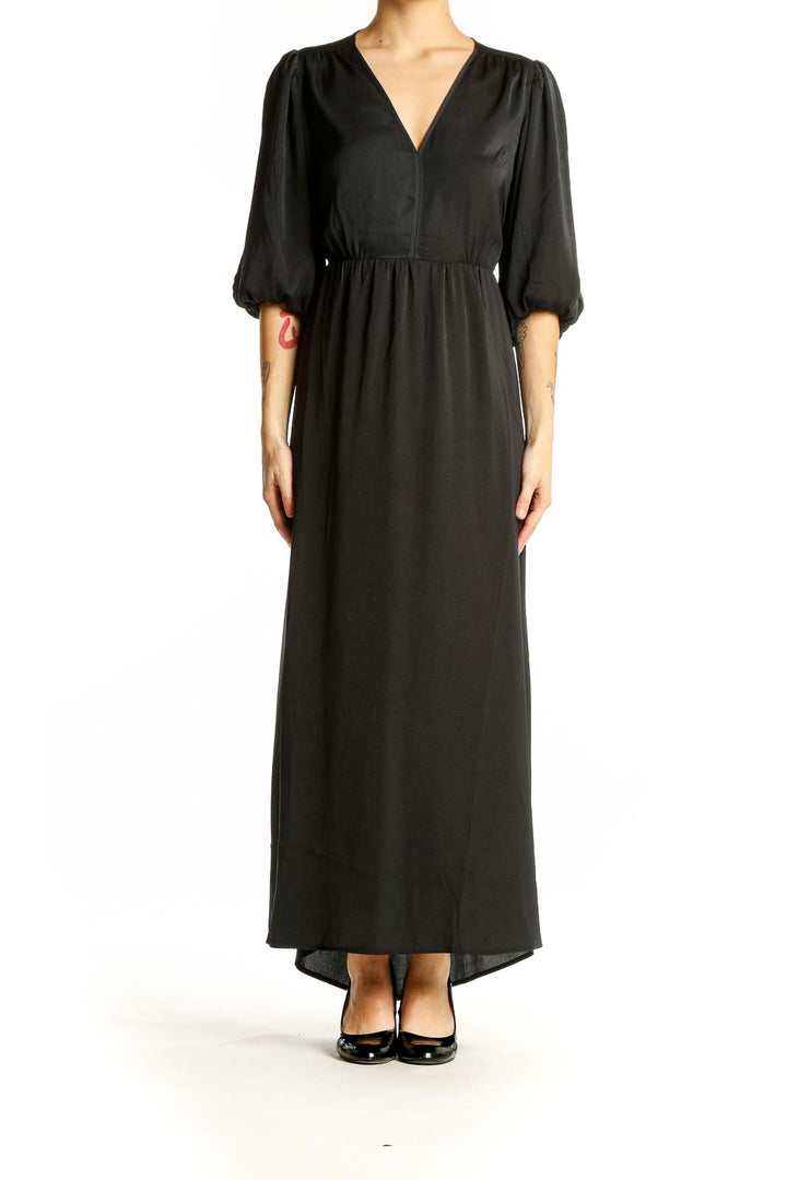 Front view of black Gap maxi dress with balloon sleeves and V-neckline