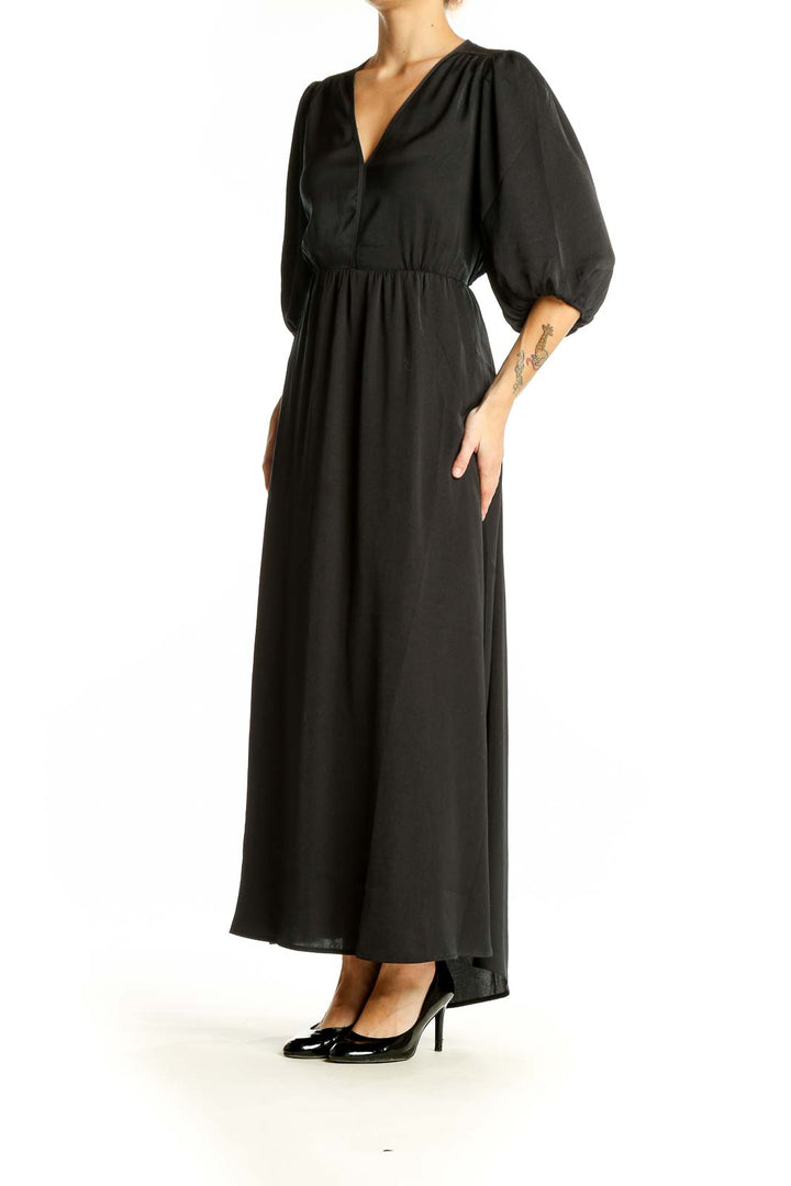 Front view of black Gap maxi dress with balloon sleeves and V-neckline