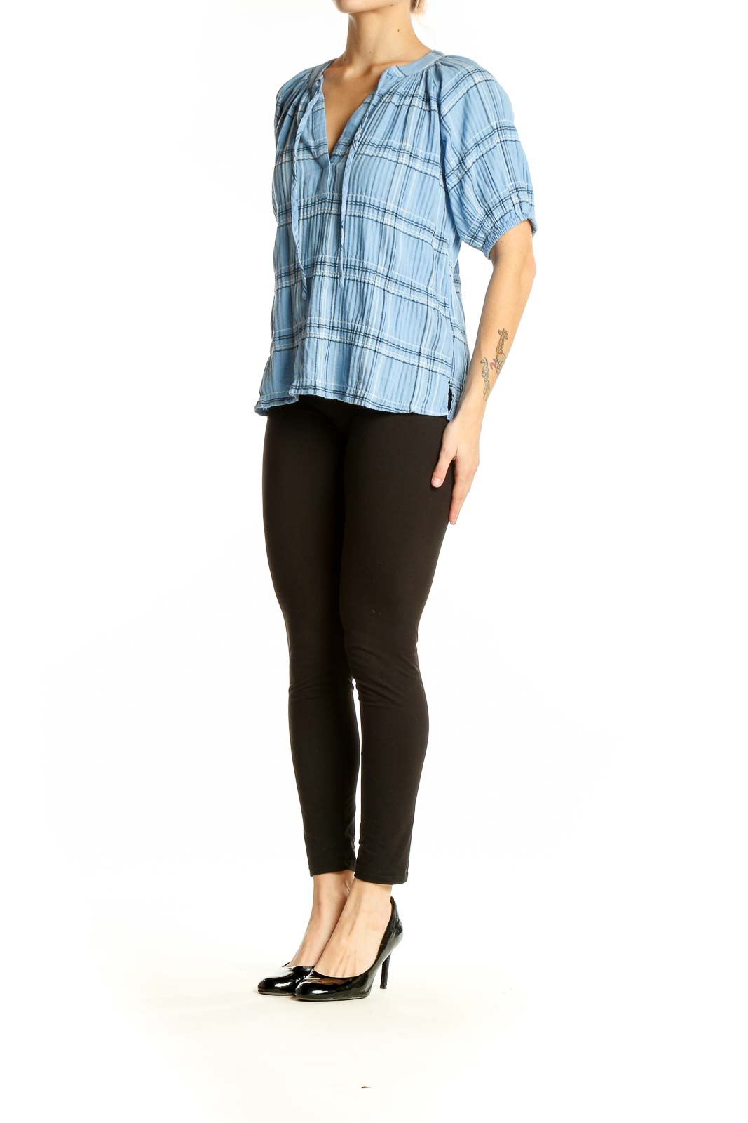 Front view of light blue plaid LOFT top with V-neck and short puffed sleeves