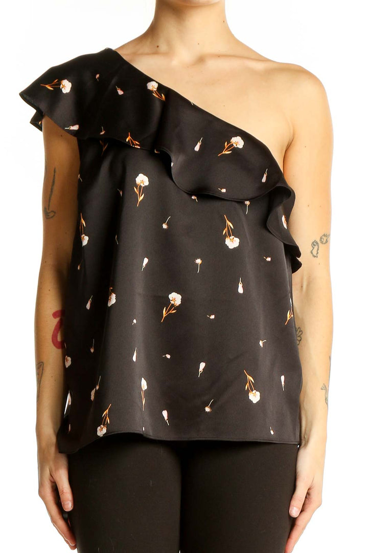 Front view of Ann Taylor black one-shoulder top with floral print and ruffle detail