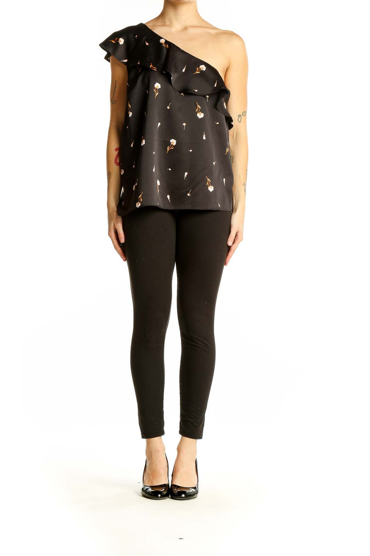 Front view of Ann Taylor black one-shoulder top with floral print and ruffle detail