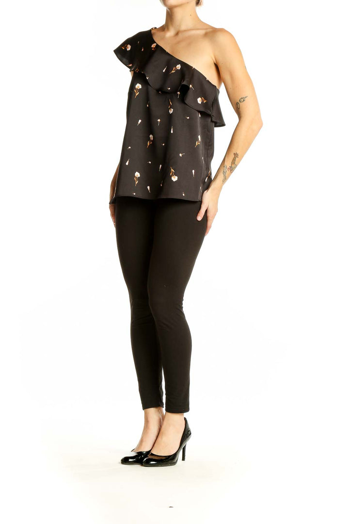 Front view of Ann Taylor black one-shoulder top with floral print and ruffle detail