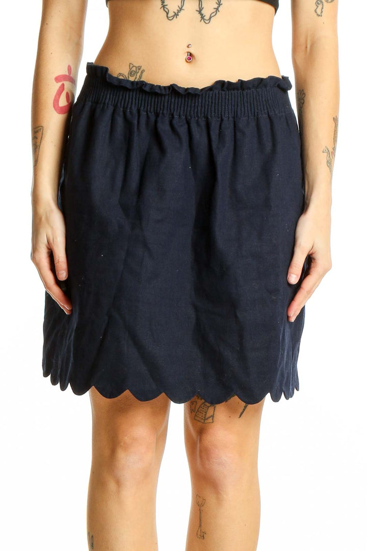 Front view of J.Crew navy skirt with scalloped hem