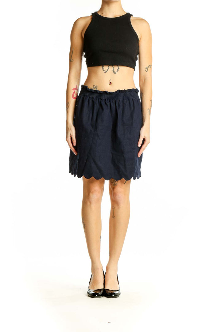 Front view of J.Crew navy skirt with scalloped hem