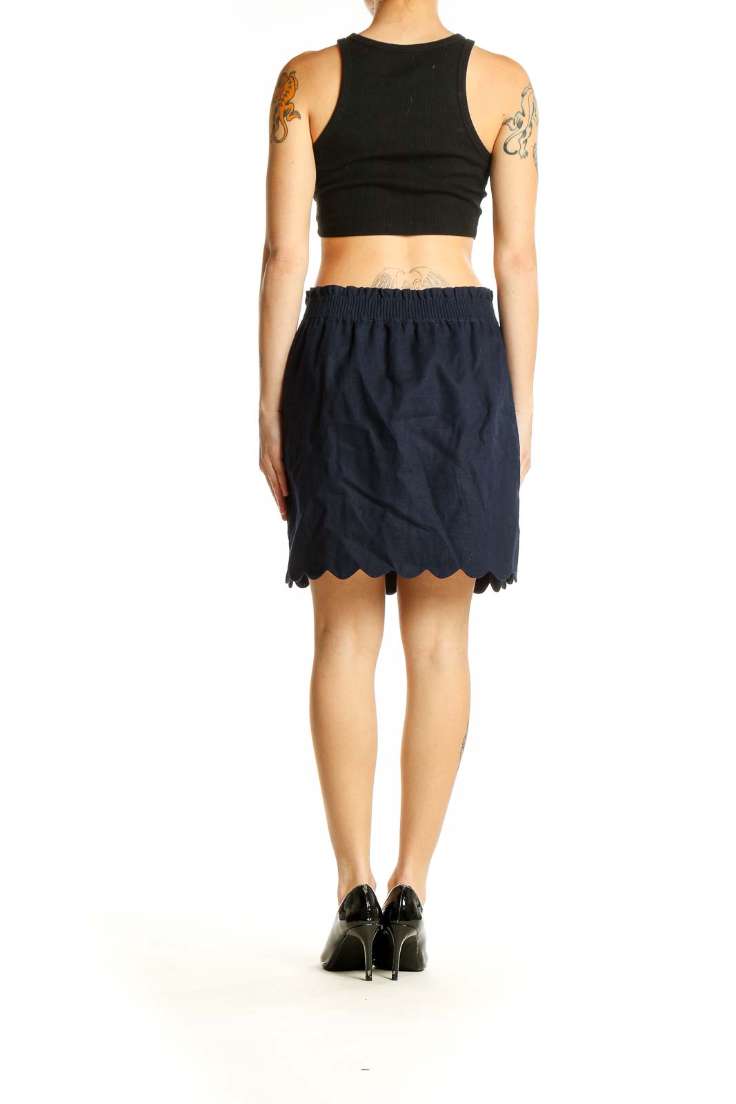 Side view of J.Crew navy skirt with black top