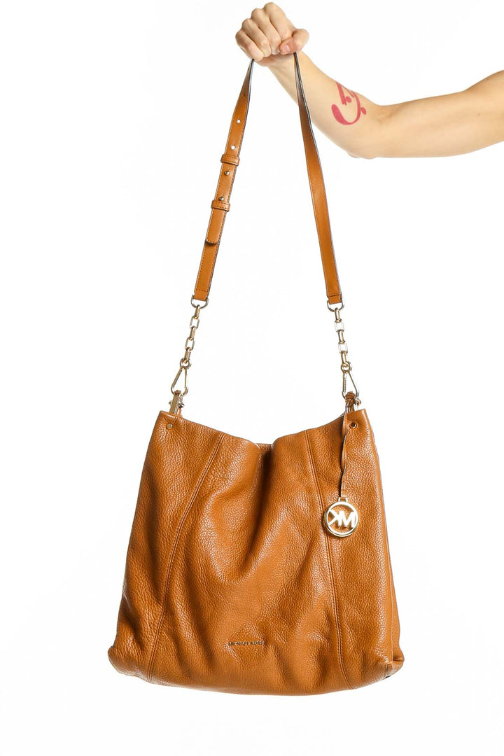 Front view of Michael Kors tan leather hobo shoulder bag with gold hardware