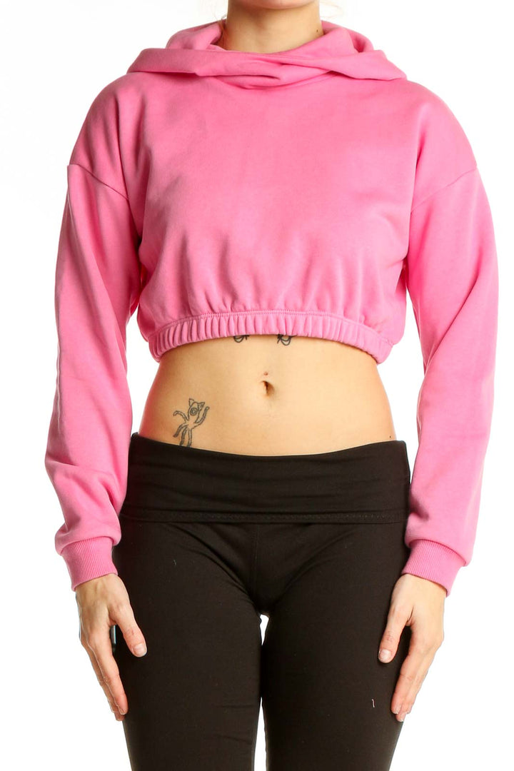 Front view of pink cropped hoodie from Naked Wardrobe