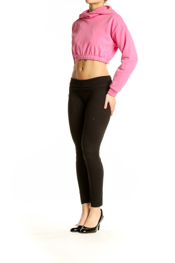 Front view of pink cropped hoodie from Naked Wardrobe