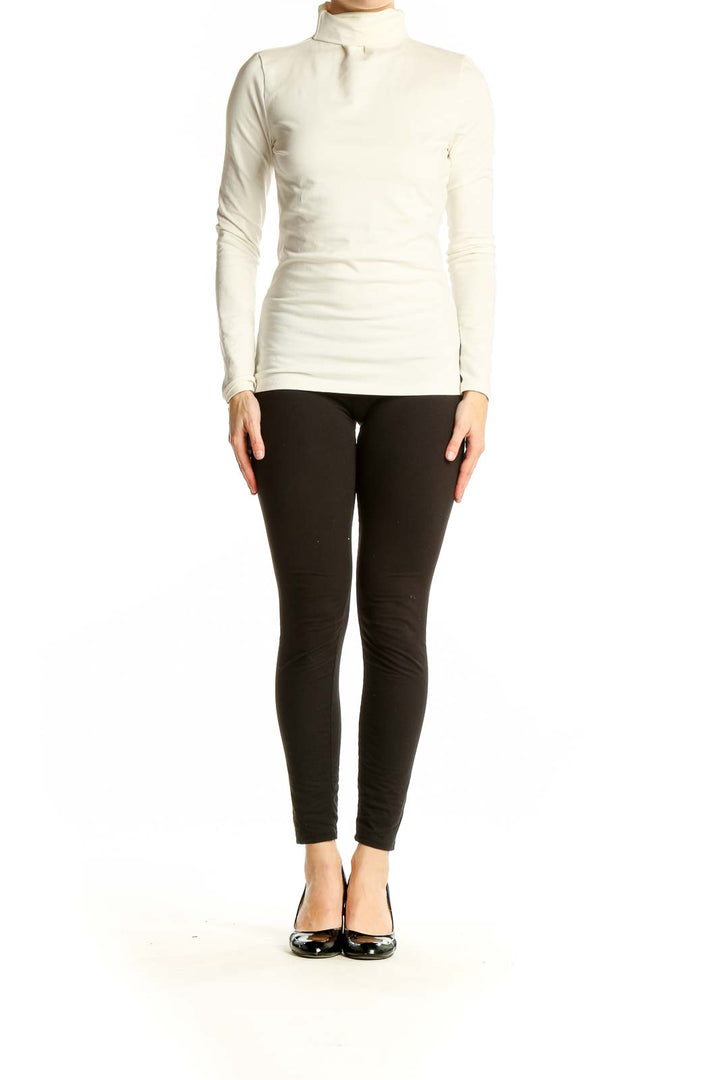 Front view of ivory Theory turtleneck top with long sleeves