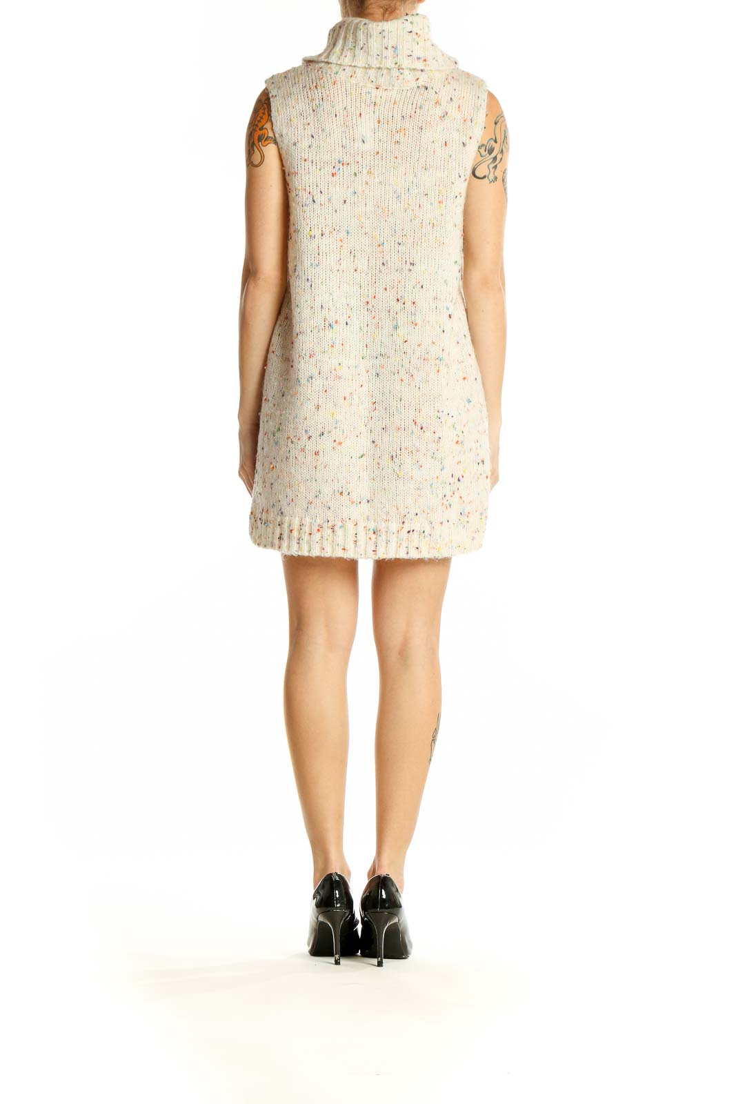 Side view of Loveriche cream speckled sleeveless turtleneck sweater dress