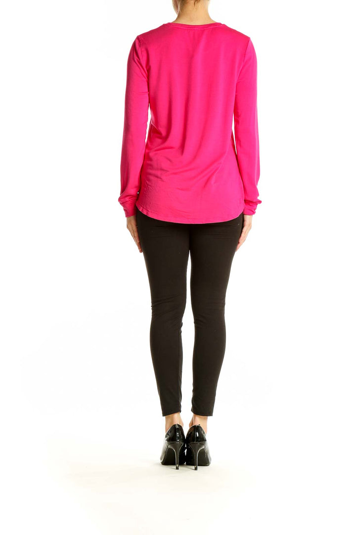 Back view of hot pink J.Crew long sleeve crew neck top on model