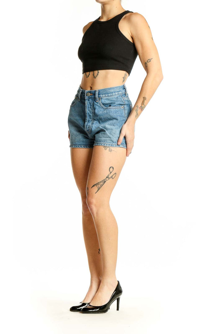 Front view of Rouge light blue high-waisted denim shorts with raw hem