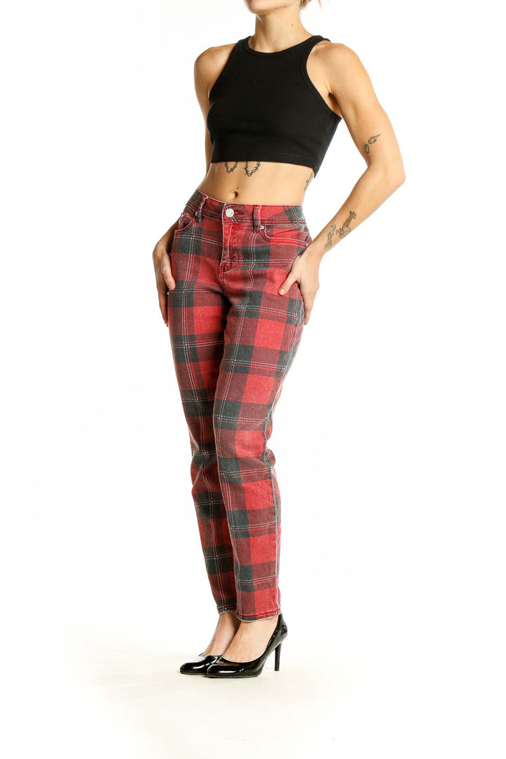 Front view of Indigo Rein red plaid jeans on model