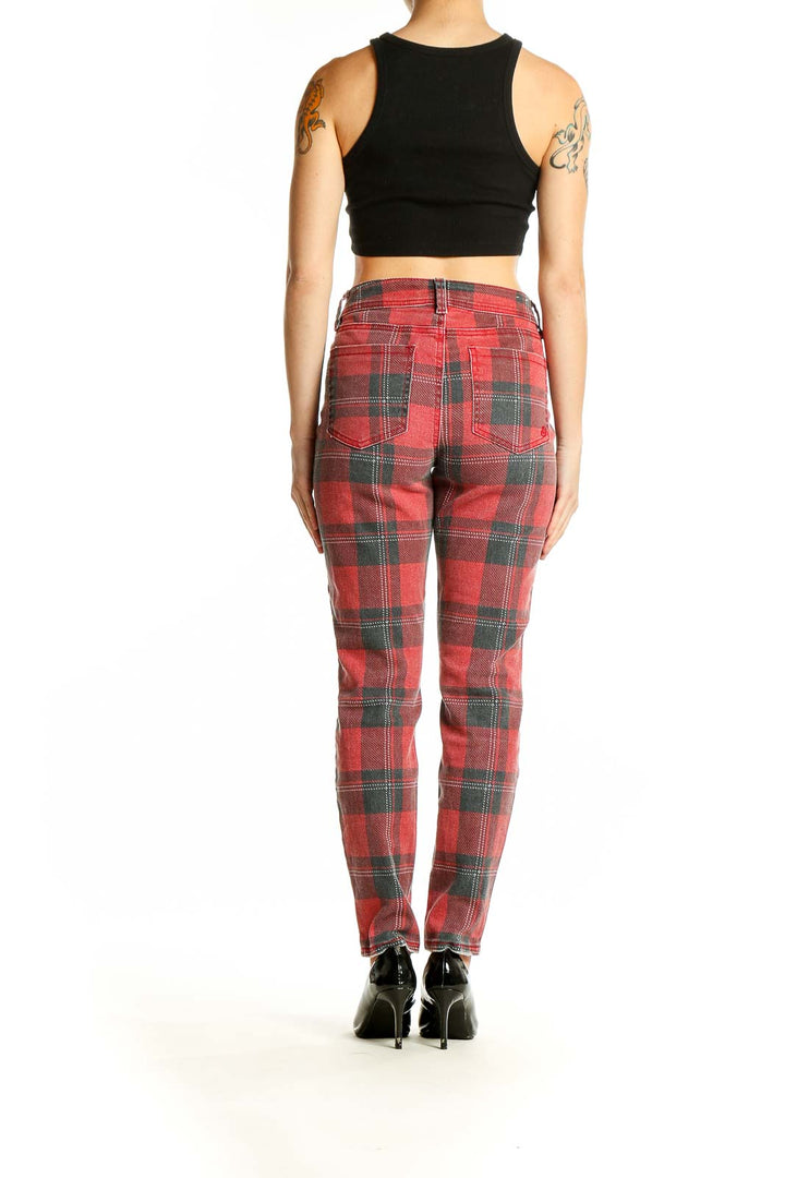 Back view of Indigo Rein red plaid jeans on model with black crop top