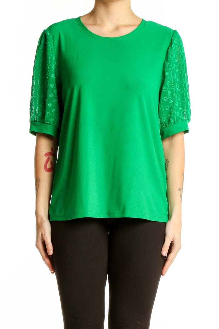 Front view of CeCe green blouse with lace sleeves